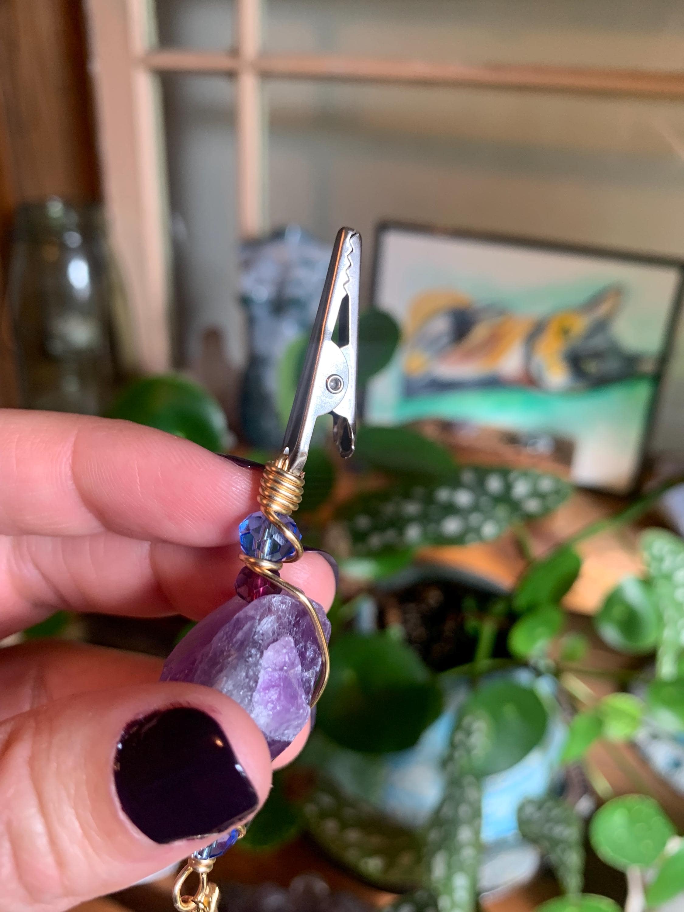 Raw Amethyst Smoke Clip with purple and blue glass beads, gold wire, evil eye, sun charm