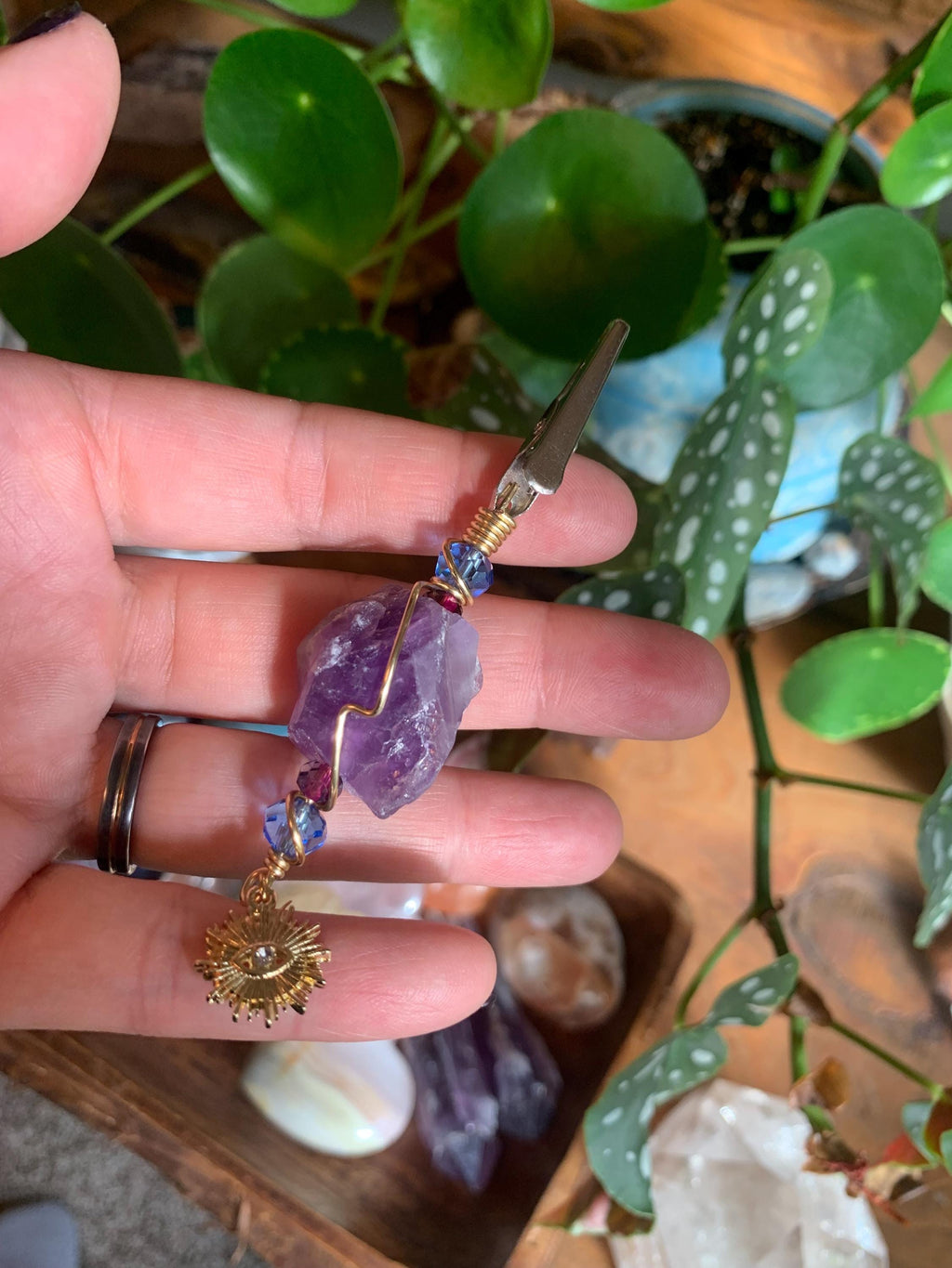 Raw Amethyst Smoke Clip with purple and blue glass beads, gold wire, evil eye, sun charm