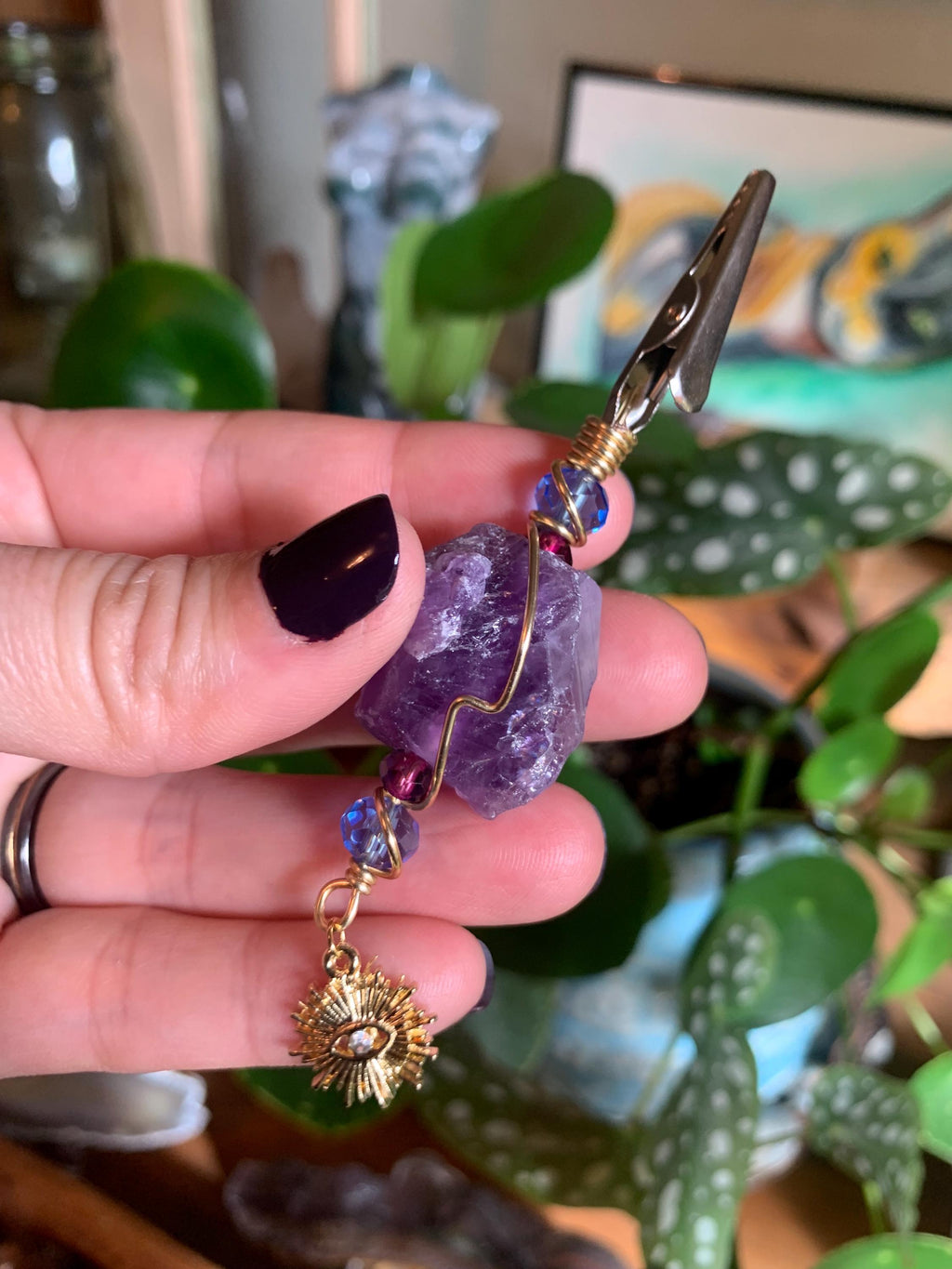 Raw Amethyst Smoke Clip with purple and blue glass beads, gold wire, evil eye, sun charm