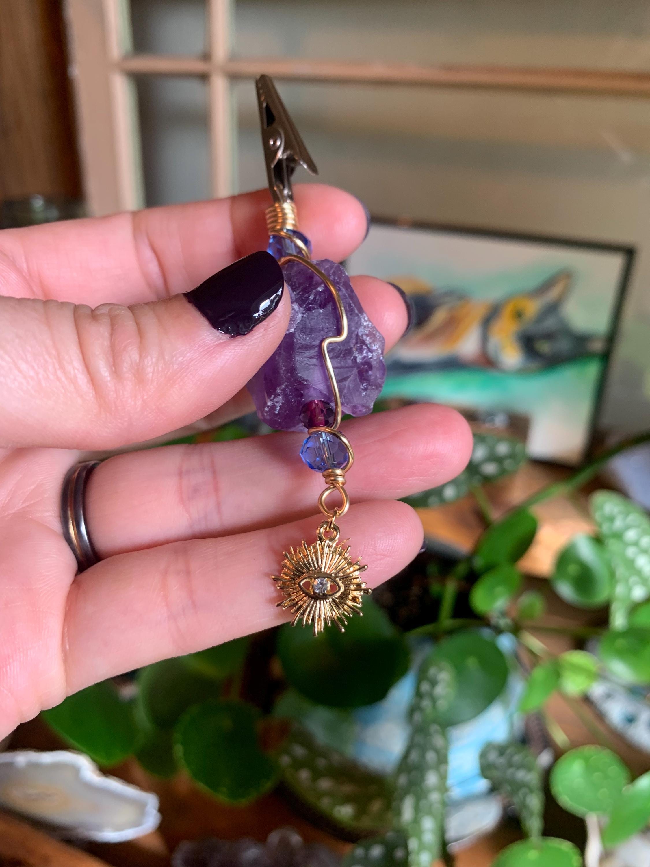 Raw Amethyst Smoke Clip with purple and blue glass beads, gold wire, evil eye, sun charm