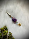 Raw Amethyst Smoke Clip with purple and blue glass beads, gold wire, evil eye, sun charm