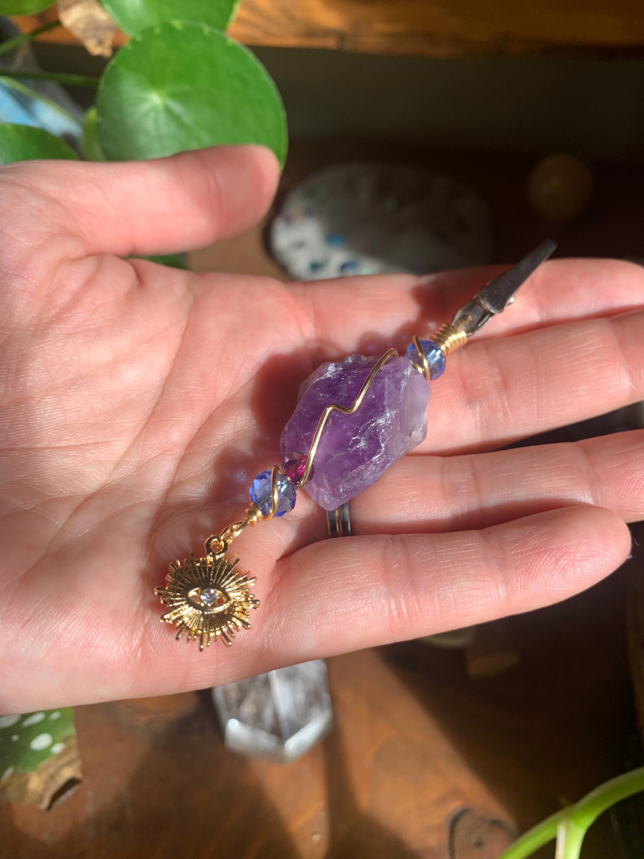 Raw Amethyst Smoke Clip with purple and blue glass beads, gold wire, evil eye, sun charm