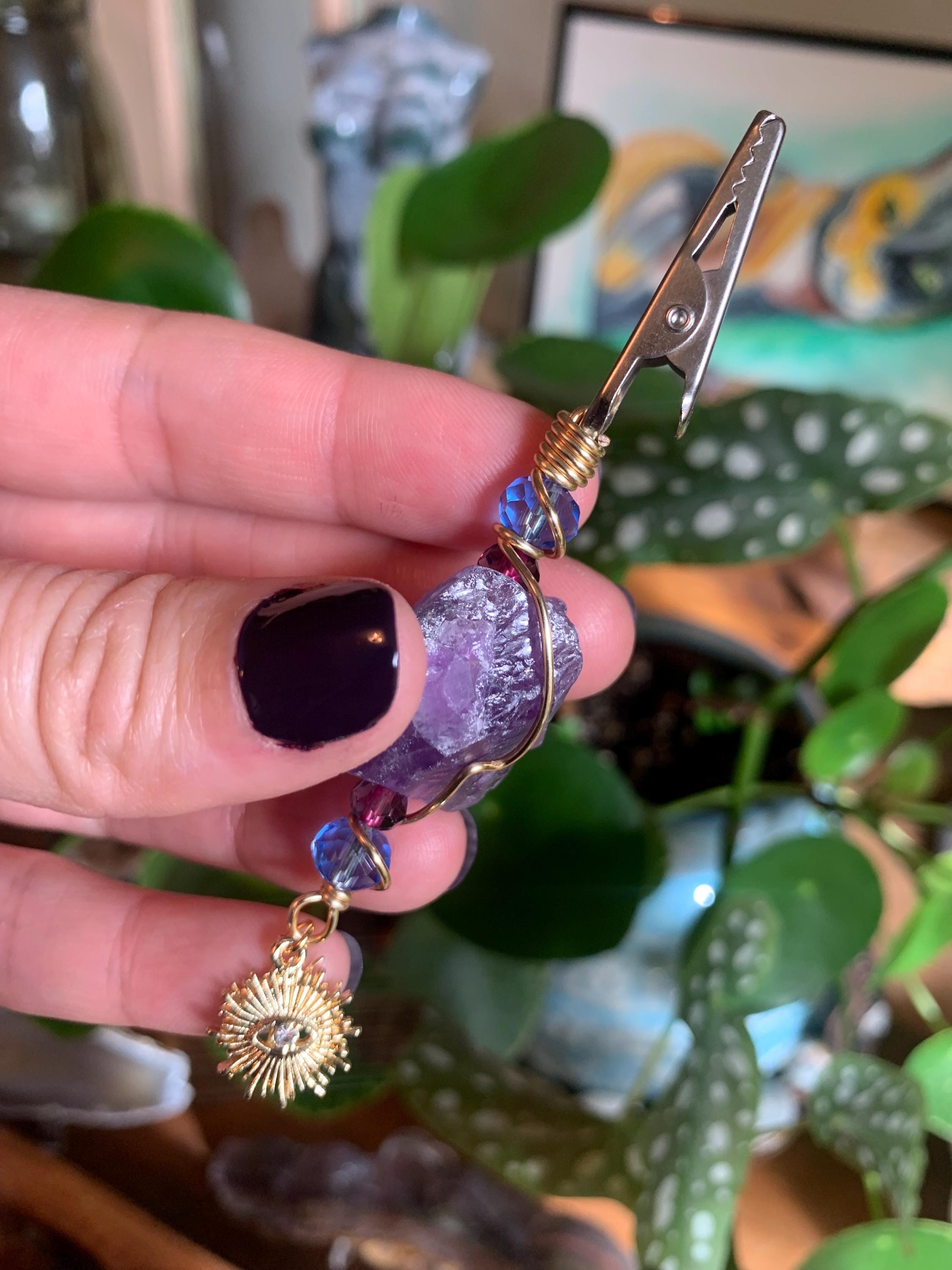 Raw Amethyst Smoke Clip with purple and blue glass beads, gold wire, evil eye, sun charm
